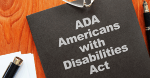 white letters on a black background that read "ADA - Americans with Disabilities Act"