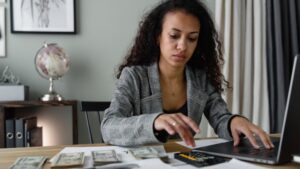 woman budgeting on her computer
